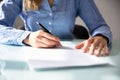 Businesswoman`s Hand Signing Contract Royalty Free Stock Photo