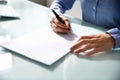 Businesswoman`s Hand Signing Contract Royalty Free Stock Photo