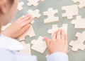 Businesswoman With Scattered Puzzle