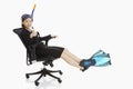 Businesswoman with scuba diving gear resting on a chair Royalty Free Stock Photo