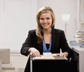 Businesswoman searches through file drawer Royalty Free Stock Photo