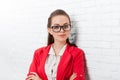 Businesswoman serious folded hands wear red jacket glasses Royalty Free Stock Photo