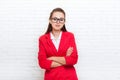 Businesswoman serious folded hands wear red jacket glasses Royalty Free Stock Photo