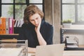 Businesswoman seriously working on computer laptop in office