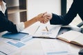 Businesswoman shaking hand for a complete business deal together Royalty Free Stock Photo