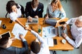 Businesswoman Shaking Hands With Coworker During Meeting In Office, Top-View Royalty Free Stock Photo