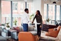 Businesswoman Shaking Hands With Male Interview Candidate In Seating Area Of Modern Office Royalty Free Stock Photo