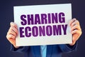 Businesswoman with Sharing economy banner