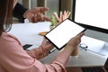 Businesswoman shearing information on digital tablet to her colleague. Royalty Free Stock Photo