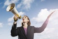 Businesswoman Shouting Through Megaphone Royalty Free Stock Photo