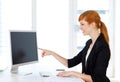 Businesswoman showing content on computer