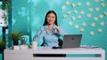 Businesswoman showing heart shape sign