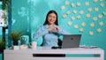 Businesswoman showing heart shape sign