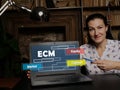 Businesswoman showing laptop with acronym ECM Equity Capital Market on the screen