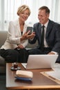 Businesswoman showing something on smartphone her business colleague Royalty Free Stock Photo