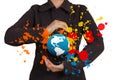 Businesswoman shows the earth and splash colors Royalty Free Stock Photo