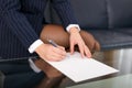 Businesswoman sign blank paper in formal wear Royalty Free Stock Photo