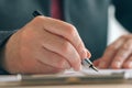 Close up of businesswoman hands signing contract and business agreement Royalty Free Stock Photo