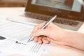 Businesswoman signing contract documents sitting at table Royalty Free Stock Photo