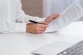 Businesswoman signing contract at white table in office, closeup of hands Royalty Free Stock Photo