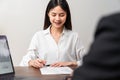 Businesswoman signing financial contract and hand holding pen. Royalty Free Stock Photo