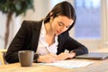 Businesswoman signing form working at office Royalty Free Stock Photo