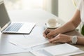 Businesswoman signing paper at workplace, executive putting sign Royalty Free Stock Photo