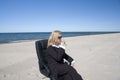 Businesswoman sipping on beach Royalty Free Stock Photo