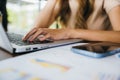 businesswoman sitting alone at cafe desk with laptop computer she looking out of Royalty Free Stock Photo