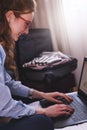 Businesswoman working in hotel room, using laptop Royalty Free Stock Photo