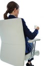 Businesswoman sitting on chair and having glass of water