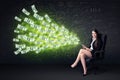 Businesswoman sitting in chair holding tablet with dollar bills Royalty Free Stock Photo