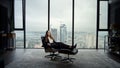 Businesswoman sitting on chair in office. Entrepreneur relaxing on office chair