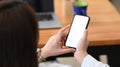 Businesswoman sitting on chair in office a using mobile phone. Royalty Free Stock Photo