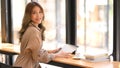 Businesswoman sitting in a co-working space, using tablet Royalty Free Stock Photo