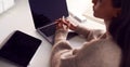 Businesswoman Sitting At Desk Using Laptop And Digital Tablet On Desk In Modern Office Royalty Free Stock Photo