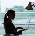 Businesswoman sitting at her desk in business concept Royalty Free Stock Photo