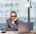 Businesswoman sitting at her desk in business concept Royalty Free Stock Photo