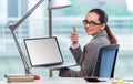 The businesswoman sitting at her desk in business concept Royalty Free Stock Photo