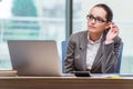 The businesswoman sitting at her desk in business concept Royalty Free Stock Photo