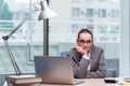 The businesswoman sitting at her desk in business concept Royalty Free Stock Photo