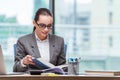 The businesswoman sitting at her desk in business concept Royalty Free Stock Photo