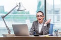 The businesswoman sitting at her desk in business concept Royalty Free Stock Photo