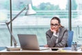 The businesswoman sitting at her desk in business concept Royalty Free Stock Photo