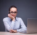 Businesswoman sitting at her desk in business concept Royalty Free Stock Photo