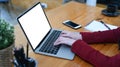 Businesswoman sitting at her office desk and working with laptop computer. Royalty Free Stock Photo