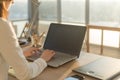 Businesswoman sitting on her workplace in the office, typing, looking at pc screen. Royalty Free Stock Photo