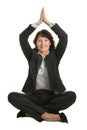 Businesswoman sitting in lotus position Royalty Free Stock Photo