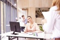 Businesswoman sitting at office desk on business meeting