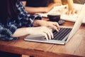 Businesswoman sitting at office desk and typing on a laptop hands close up , anonymous face Royalty Free Stock Photo